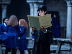 Jenna Ortega in 'Wednesday' standing in Nevermore Academy, where 'Wednesday' was filmed. 