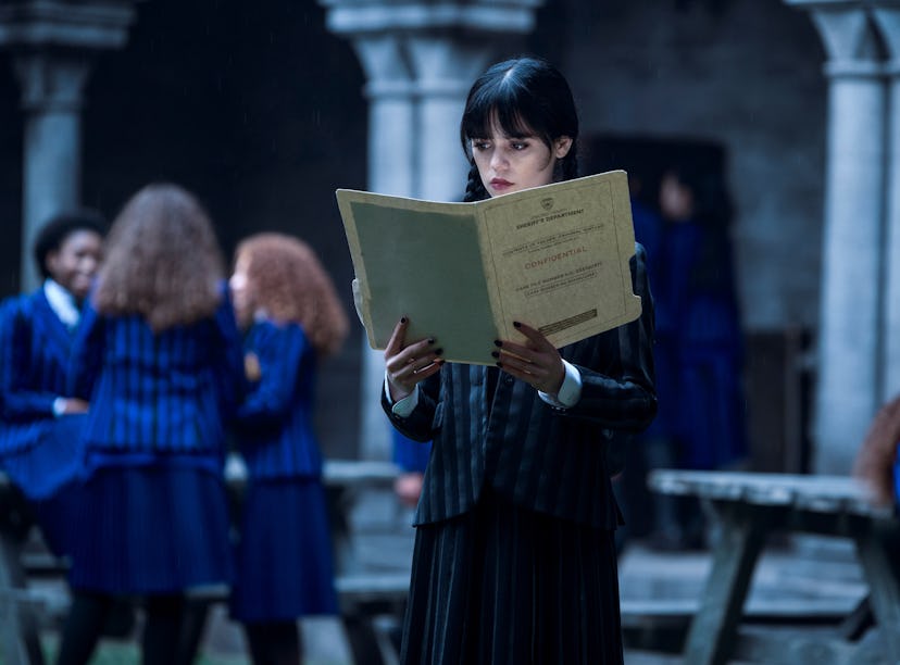Jenna Ortega in 'Wednesday' standing in Nevermore Academy, where 'Wednesday' was filmed.