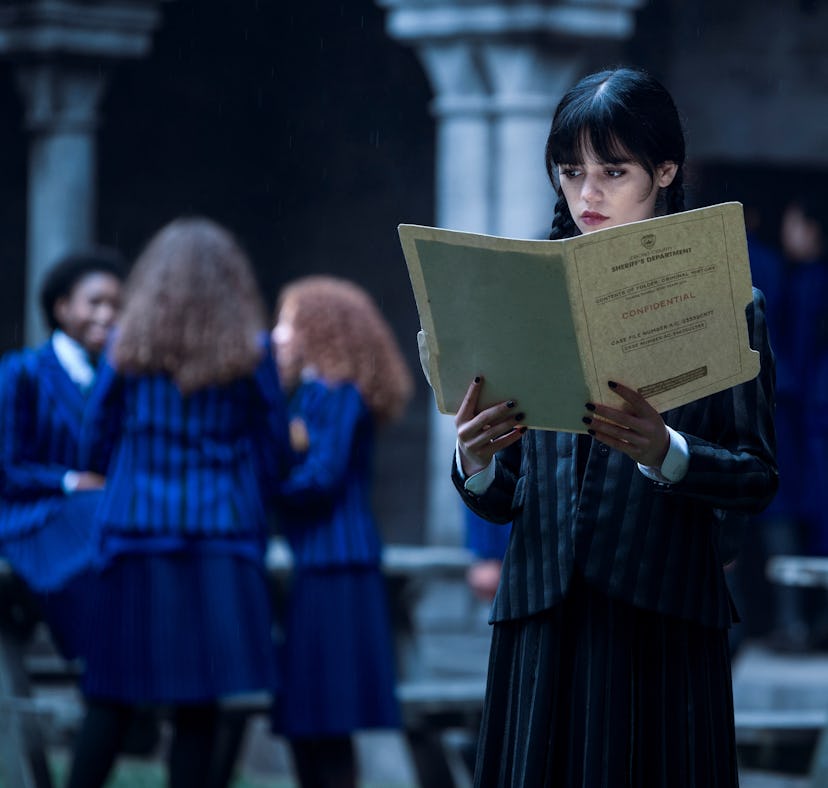 Jenna Ortega in 'Wednesday' standing in Nevermore Academy, where 'Wednesday' was filmed.