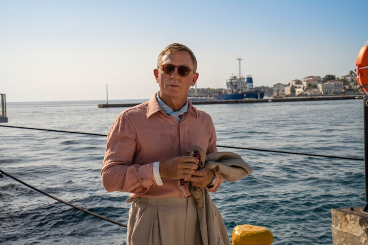 Daniel Craig stands in Greece in 'Glass Onion,' which is where 'Knives Out 2' was filmed. 