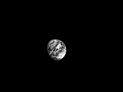 black and white image of Earth captured by Orion