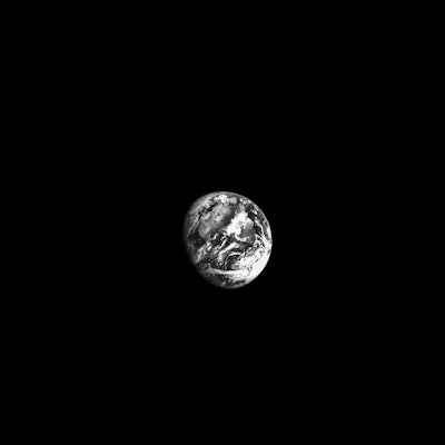 black and white image of Earth captured by Orion
