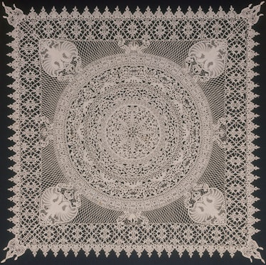 a square of white lace against a black background