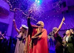 Guests enjoy the 'Harry Potter' Yule Ball in Houston with interactive performers. 