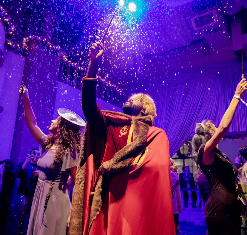 Guests enjoy the 'Harry Potter' Yule Ball in Houston with interactive performers.