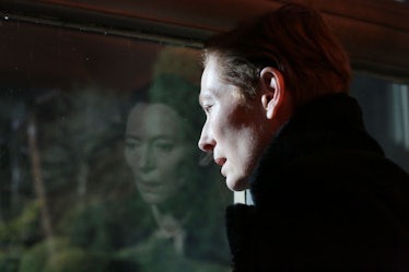 Tilda Swinton in the eternal daughter looking out the window