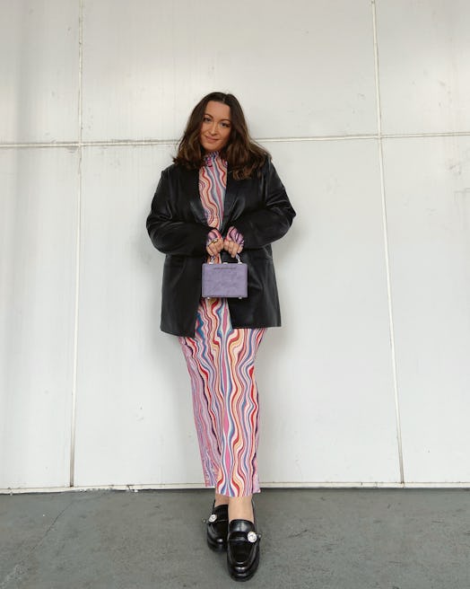 Model wears a patterned AFRM dress, leather blazer and Kate Spade loafers.