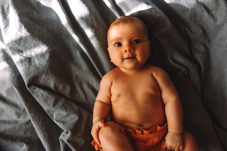 A baby in bed.