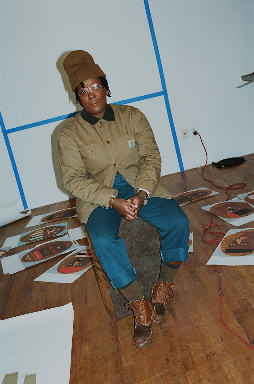 Nina Chanel Abney sits in her printmaking studio in Manhattan, New York amongst her works, spread ou...