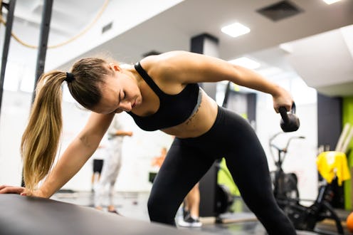 The best lat exercises with dumbbells, according to trainers.