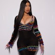 Cardi B long hair center part with jeweled outfit and pink nails