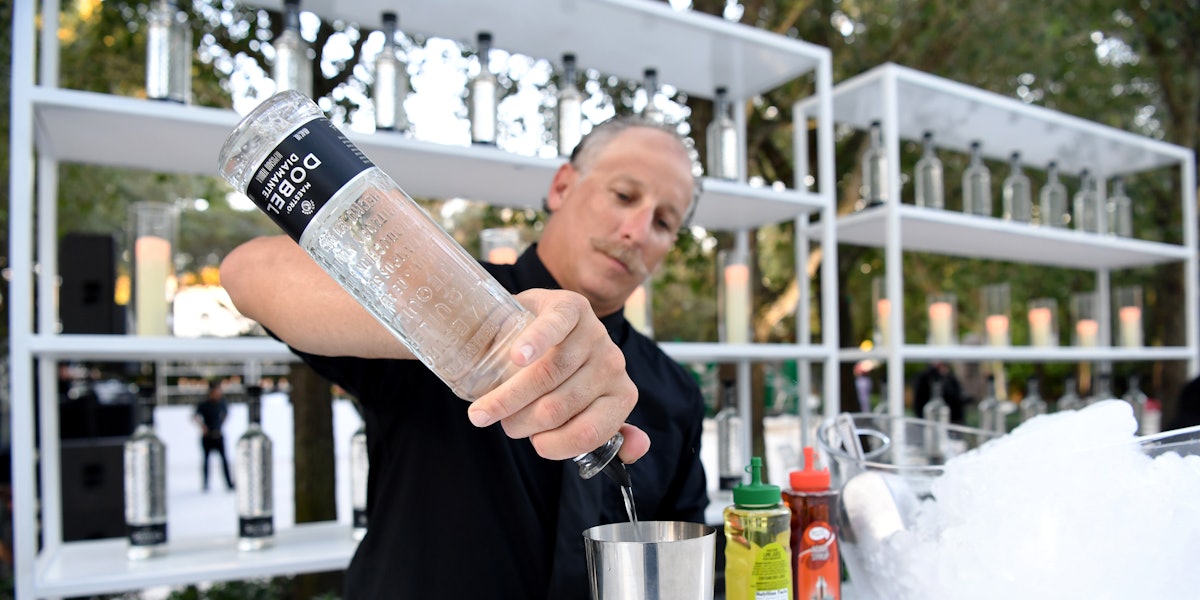 bartender pouring tequila