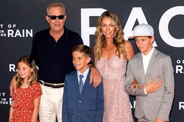Costner, Christine Baumgartener, and their three kids at the premiere of "The Art of Racing in the R...