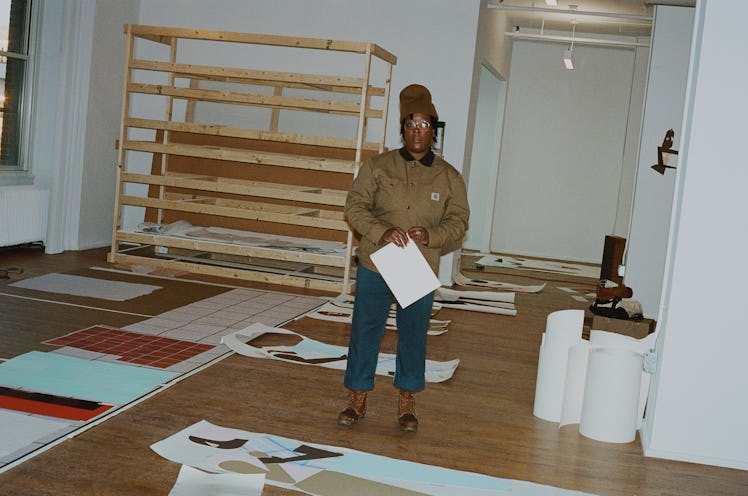 Nina Chanel Abney standing in her studio