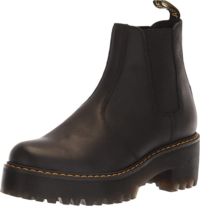 a pair of dr. martens chelsea boots with a lug sole