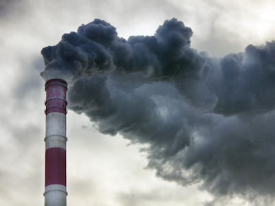 Air pollution emitting from a smokestack into the sky