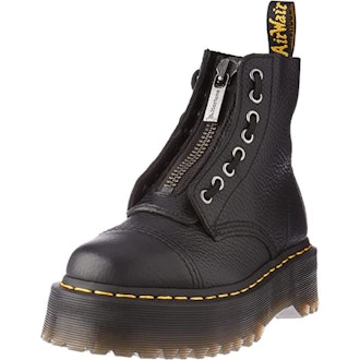 a pair of dr. martens sinclair boots with a front zipper and removable laces