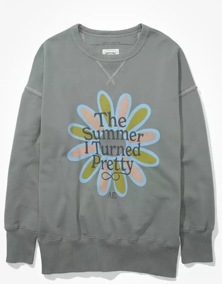 American Eagle's AE x The Summer I Turned Pretty Sweatshirt in green with a flower graphic.