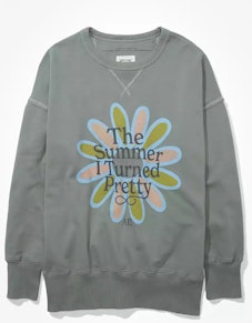 American Eagle's AE x The Summer I Turned Pretty Sweatshirt in green with a flower graphic.