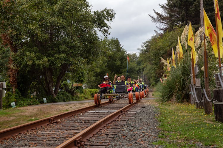 A railbiking tour pedals along a track