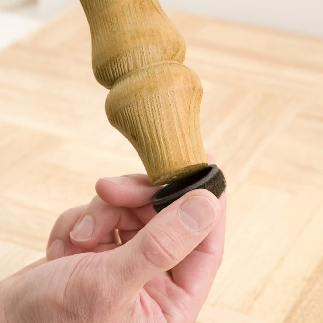 These chair glides for hardwood floors pop on like caps and have sticky adhesive.