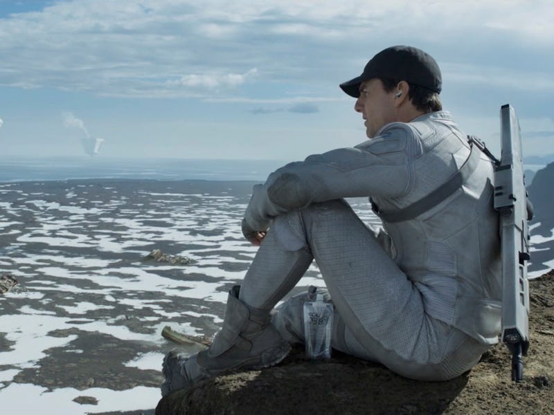 Tom Cruise sits above a futuristic landscape in 2013's Oblivion