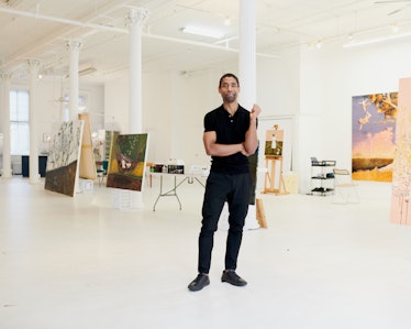 Antonio standing in his massive SoHo loft studio