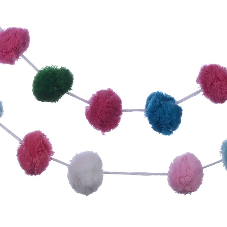 This pom pom garland is part of the 2022 holiday home decor trends, according to experts. 