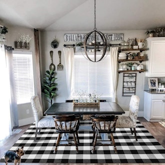 This rug under kitchen table features a buffalo plaid pattern for a farmhouse look.