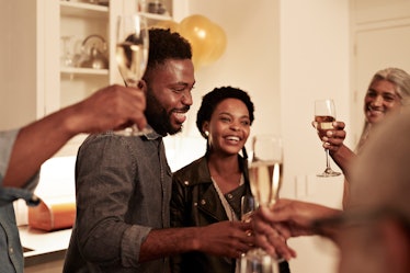 A family drinking champagne at a holiday party.