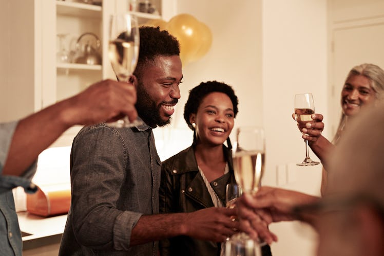 A family drinking champagne at a Christmas party