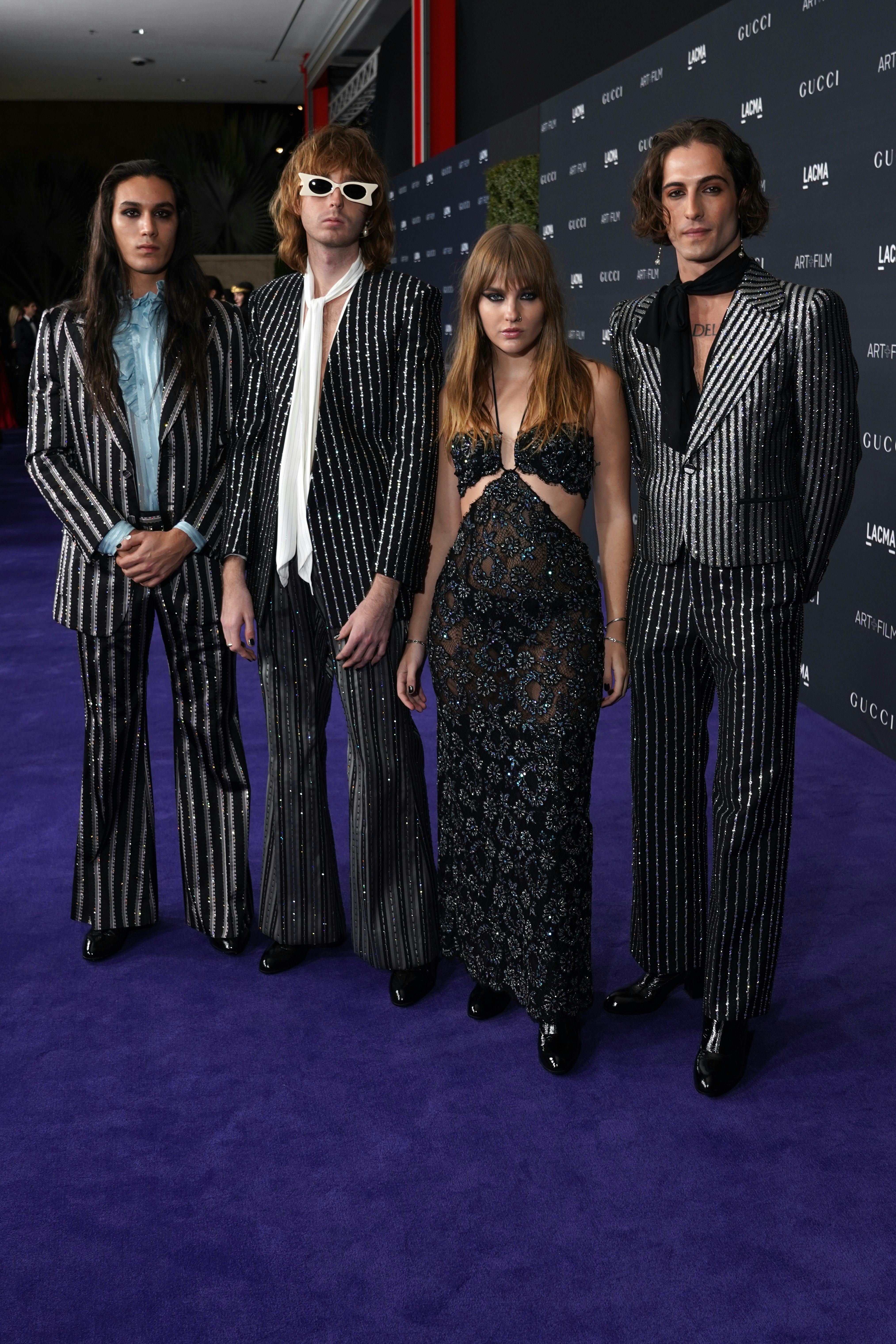 Ethan Torchio, Thomas Raggi, Victoria De Angelis, and Damiano David of Måneskin, all wearing Gucci, ...