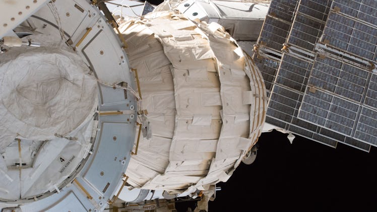 An image of the BEAM module attached to the ISS in space.