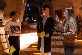 Leslye Headland (far left) directs Amandla Stenberg and Lee Jung-jae on the set of The Acolyte.