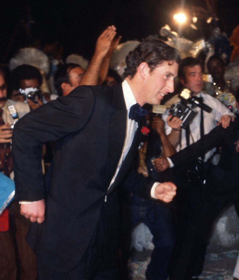 RIO DE JANEIRO, BRAZIL - 1978: Prince Charles, Prince of Wales dances with a Samba dancer at a party...