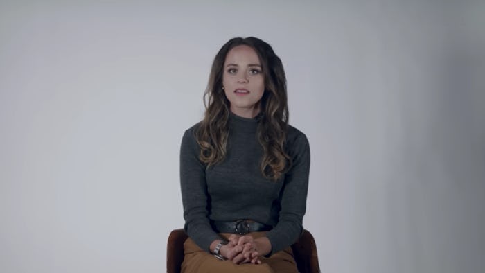 Jinger Duggar Vuolo sits against a white backdrop discussing her new book 'Becoming Free Indeed.'