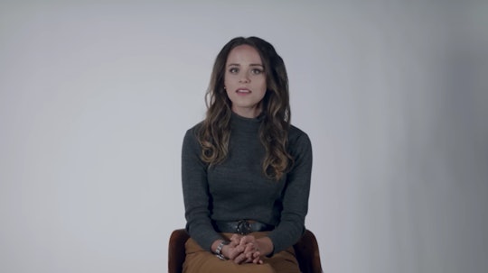 Jinger Duggar Vuolo sits against a white backdrop discussing her new book 'Becoming Free Indeed.'