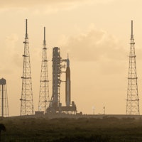 NASA’s Space Launch System (SLS) rocket with the Orion spacecraft aboard is seen atop the mobile lau...
