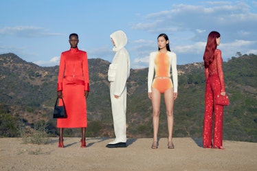 models wearing red orange and white in a desert landscape