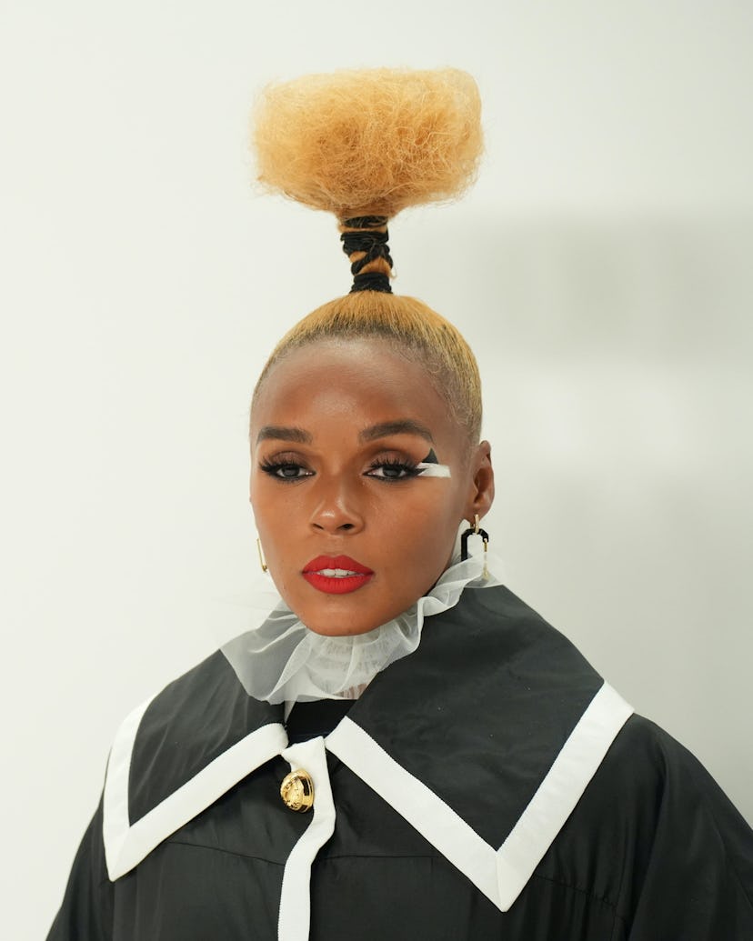 Janelle Monae attended 2022 CFDA Fashion Awards with her blonde, natural hair in a structural updo.