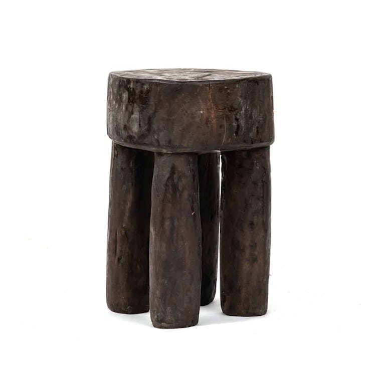 A wood chair stool is a Kendall Jenner inspired bathroom item for self-care routines.