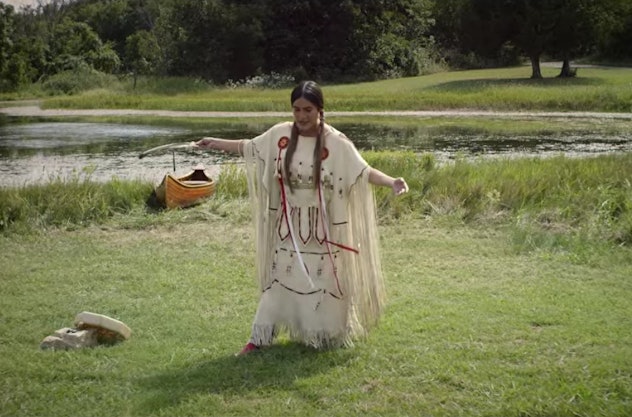 Te Ata tells a story in traditional Chickasaw clothing.
