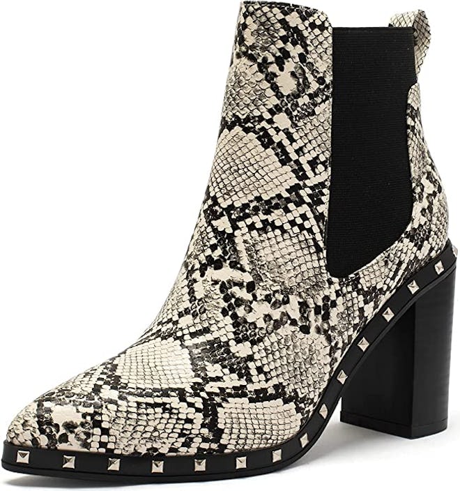 a pair of snakeskin booties with stud details