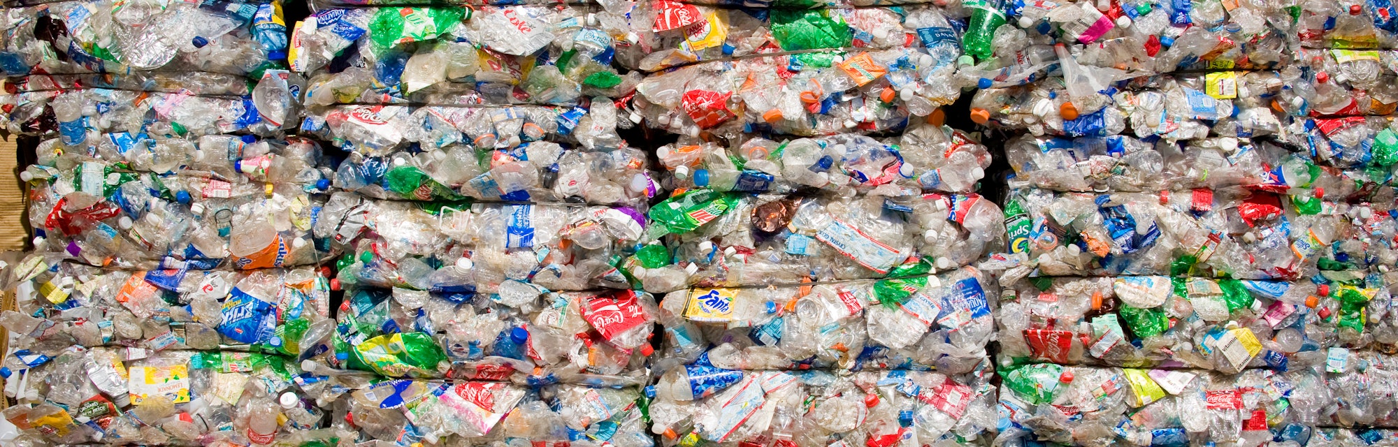 Stacks of compressed plastic products for recycling