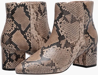 a pair of snakeskin booties with a low block heel