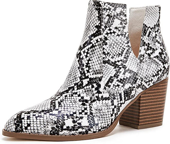 a pair of snakeskin booties with a cutout detail