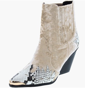 a pair of faux-suede booties with snakeskin detail along the toe