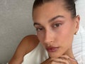 Hailey Bieber taking a selfie at home where she also inspires TikTokers to show off how to make Hail...