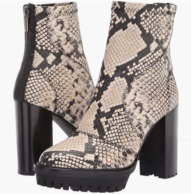 a pair of snakeskin booties with a lug sole and 3.5-inch heel