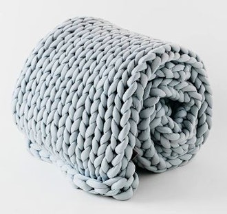 These chunky knit warm blankets are incredibly cozy and have a weighted design.
